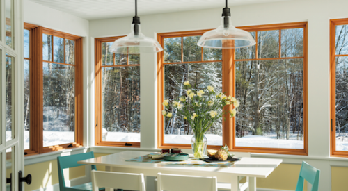 The large expanse of Andersen Windows in this kitchen connect the space to the outdoors