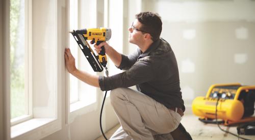 Home builder using a nailer for a door installation