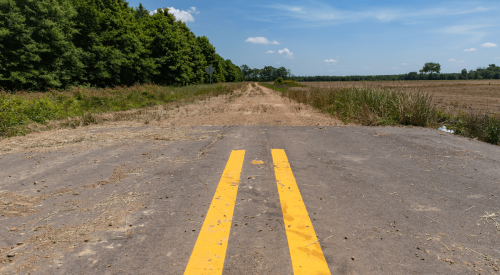 End of paved road where dirt road begins