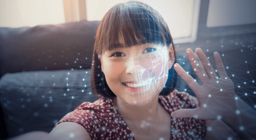 AI facial recognition for young woman raising her hand