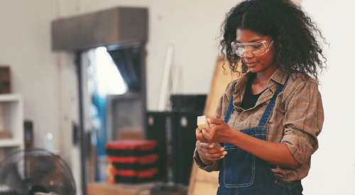 Female carpenter in training in skilled trades training academy 