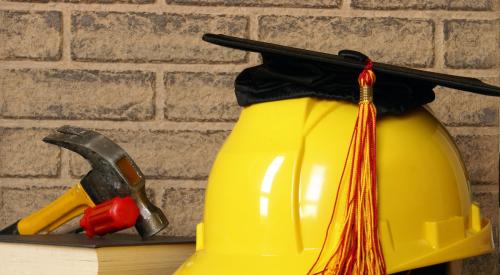 Hammer, books, hard hat and graduation cap