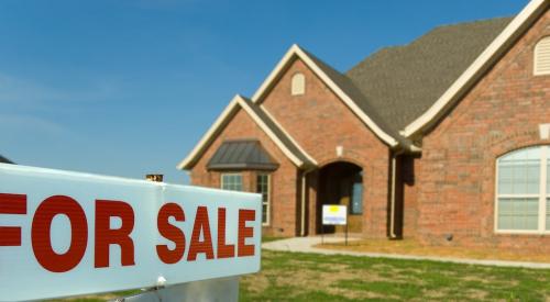 Home for sale with sign