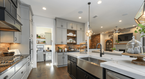 Kitchen with island connected to dining area