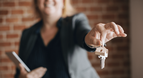 Labor union presenting keys to a home