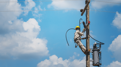 Lineman servicing electrical transformer despite shortage of electrical components  