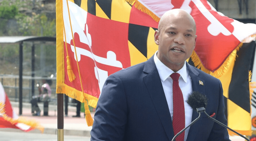 Maryland Governor Wes Moore talks to the press outdoors