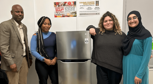 Medgar Evers College students with refrigerator