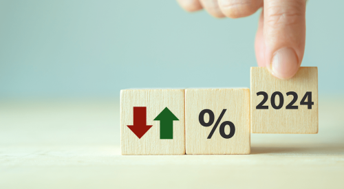 Mortgage rate percentage symbol on wooden block with green up arrow and red down arrow