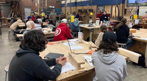 Students in workshop listening to speaker