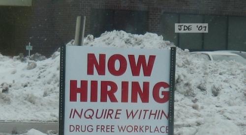 "Now hiring" sign to attract new employees.