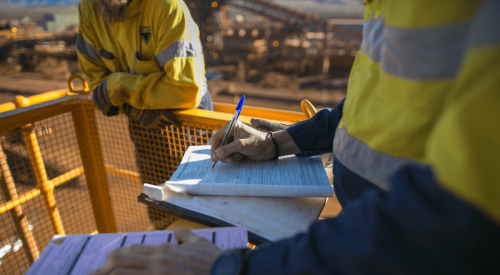 Completing a form on a construction jobsite