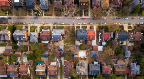 Aerial view of older single-family homes that need better energy efficiency