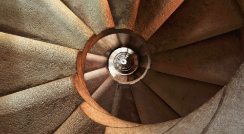 spiral staircase with stone steps in a building