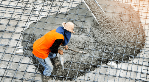 Pouring concrete slab on construction jobsite