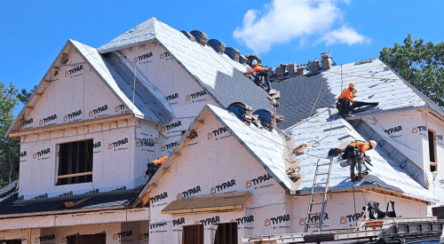 Installing a roof on a new home using roofing underlayment