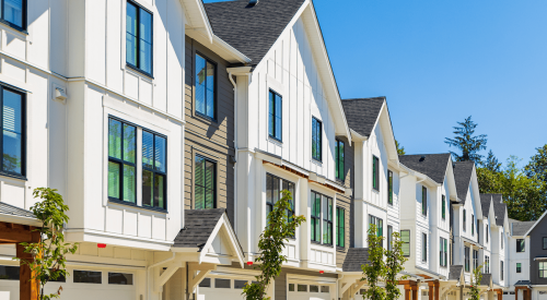 Row of modern farmhouse-style new-construction homes