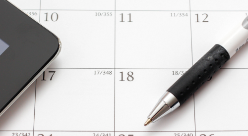 calendar and pen for scheduling home building business