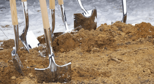 Shovels in dirt for groundbreaking ceremony