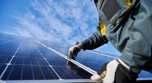 Solar panels being installed on residential roof