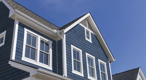 Tando's TandoShake Cape Cod Perfection siding in Mariner Blue with white trim