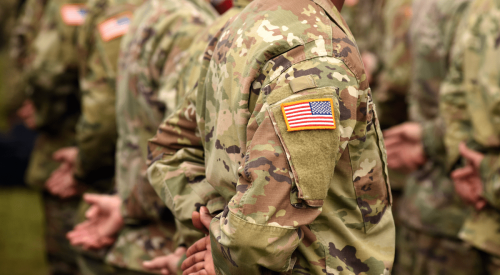 Members of U.S. army standing at ease