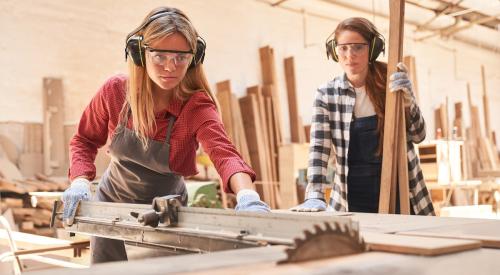 Women using circular saw