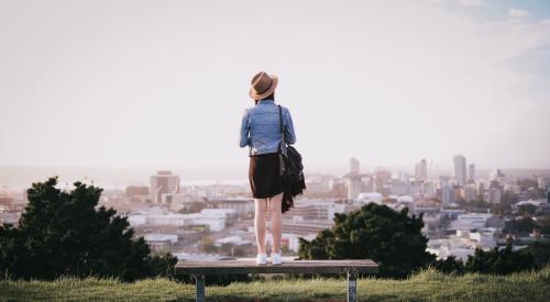 Woman overlooking cityscape