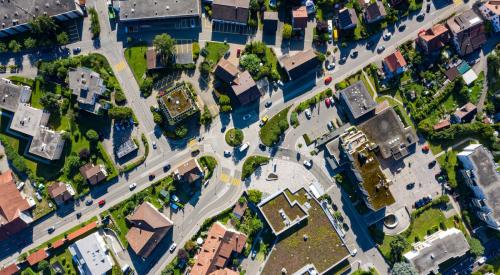 Aerial view of homes and businesses in metro area