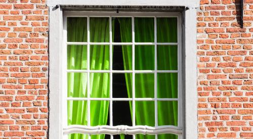 Window with green curtains