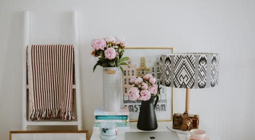 House interior with desk, bouquet, lamp, ladder