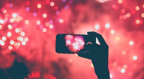 Person taking photo of fireworks