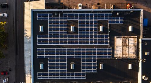 Apartment building aerial view of rooftop solar