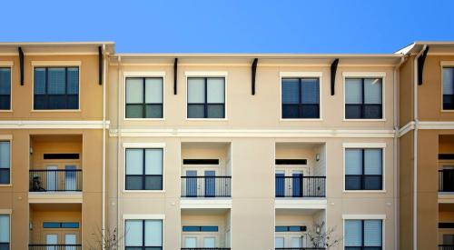 Exterior of multifamily apartment building with balconies