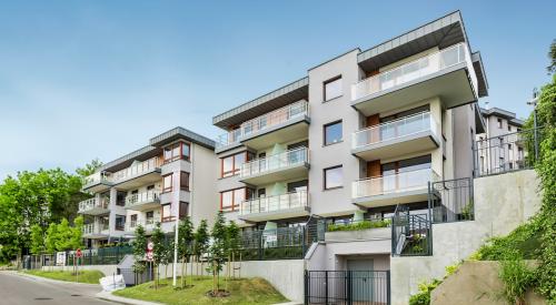 Exterior of modern gray multifamily apartment building