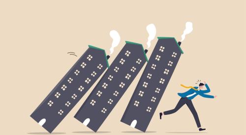 Cartoon graphic of apartment buildings falling toward businessman running away