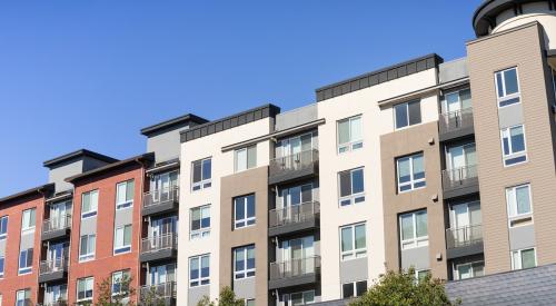 Exterior of multifamily apartment building with stucco finish