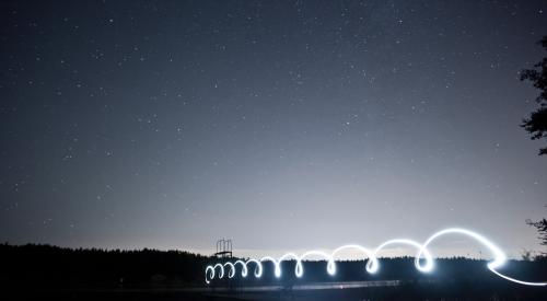 Light streaks over a lake