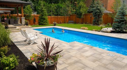 Beautiful backyard with rectangular in-ground swimming pool