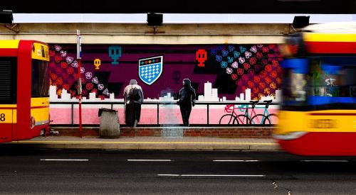 Mural of people standing at diner on city street