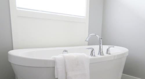 Bath tub in on-trend primary bathroom