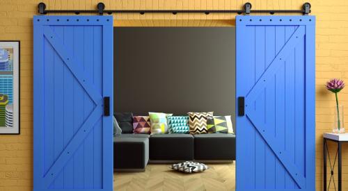 Bright blue barn doors in home loft