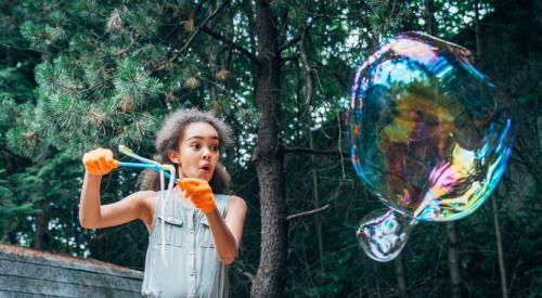 Girl blowing bubbles