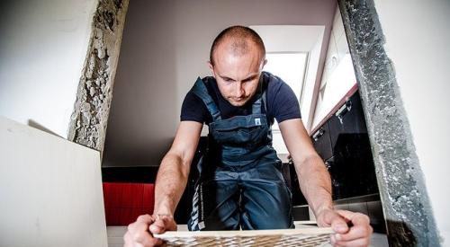 Builder Laying Tile