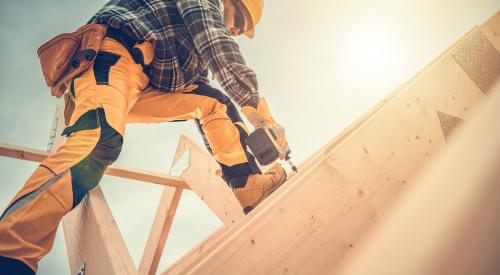 Carpenter working on new-construction home