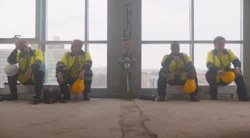 Builders looking stressed on break from work