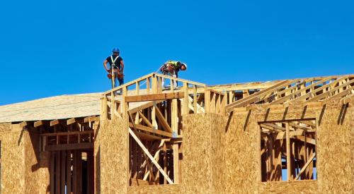 Workers building new house