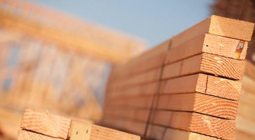 Stacks of building lumber boards