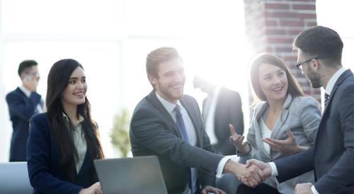 Shaking hands after a business acquisition deal has been completed