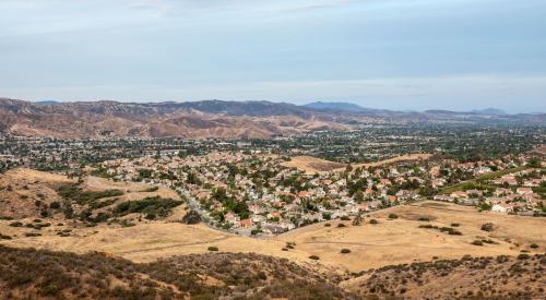 Housing neighborhood in dry landscape from California drought